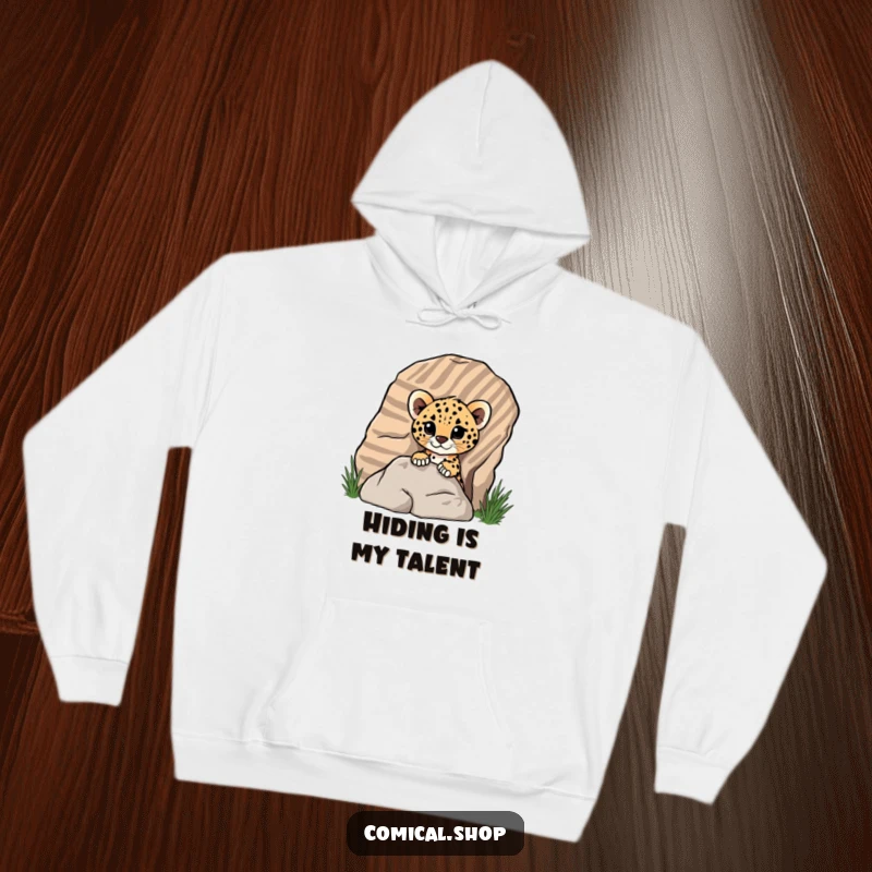 Funny cheetah cub peeking out from behind a rock on a cozy hoodie, perfect for screen reader users to imagine a cute surprise.